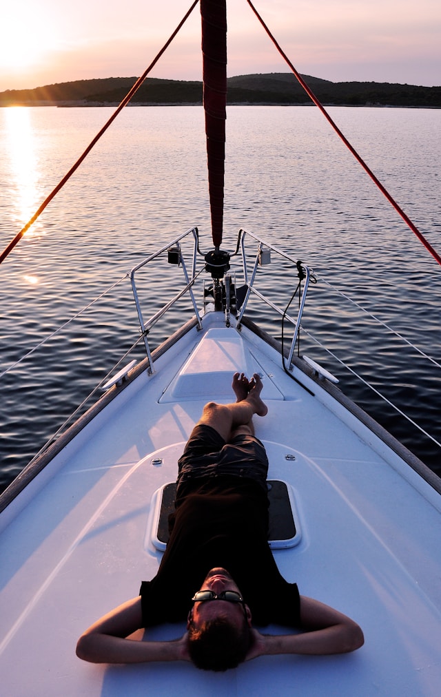 man laying on a boat