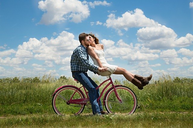man and woman on a bike