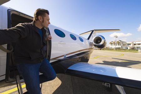 Why Fractional Jet Ownership Could Be Your Ticket to the Skies man coming out of private jet